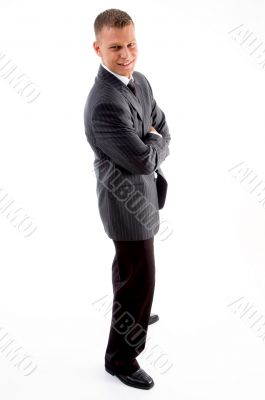 standing handsome male with crossed arms