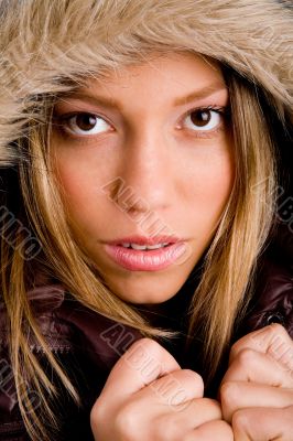 portrait of young woman holding her winter coat