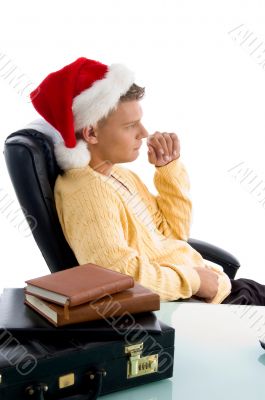 side pose of male wearing christmas hat