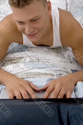 handsome man working on his personal laptop