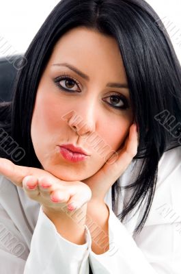 woman giving flying kiss