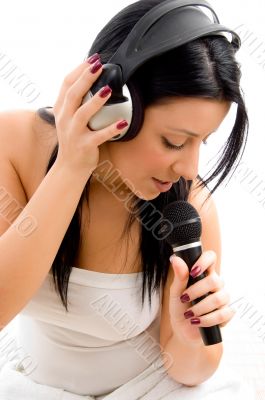  young female holding headphone and microphone