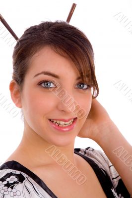 smiling Japanese woman with hair sticks