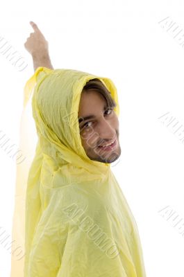 pointing male wearing raincoat