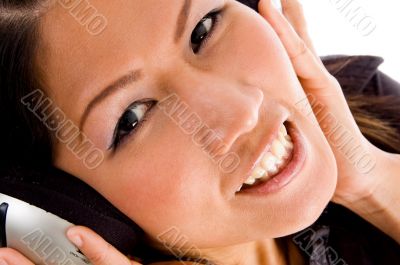 female looking at camera while listening to music