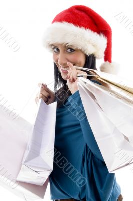 happy christmas model carrying shopping bags