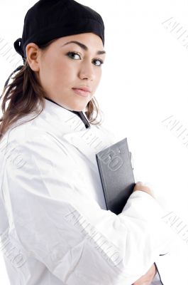 beautiful female chef holding notepad