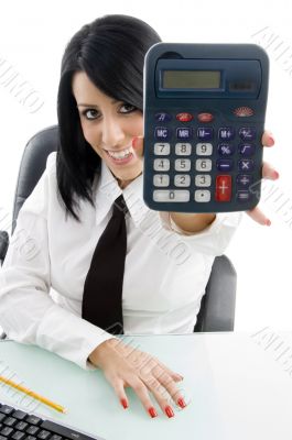 young woman showing calculator