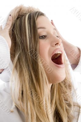 happy female holding her jacket cap on her head