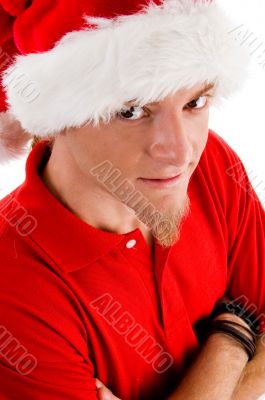 male wearing christmas hat looking at camera