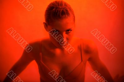 Young sexy woman portrait, red light