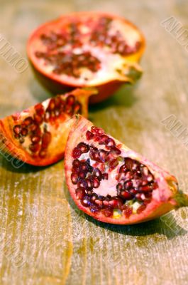 broken ripe pomegranate fruit and seeds