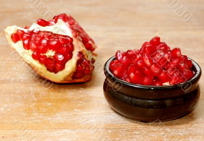 broken ripe pomegranate fruit and seeds