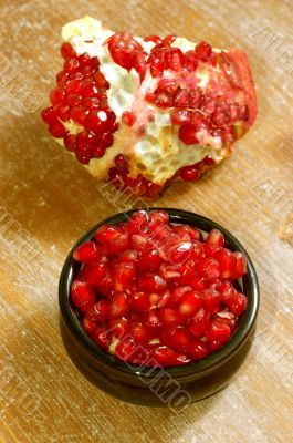 broken ripe pomegranate fruit and seeds