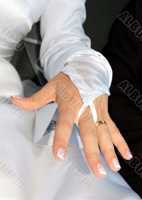 Hand of the bride with wedding ring