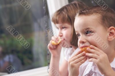 Sister and Brother Eating an Apple