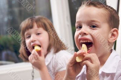 Sister and Brother Eating an Apple
