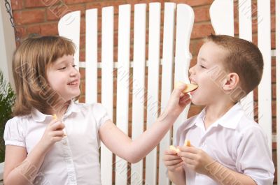 Sister and Brother Eating an Apple