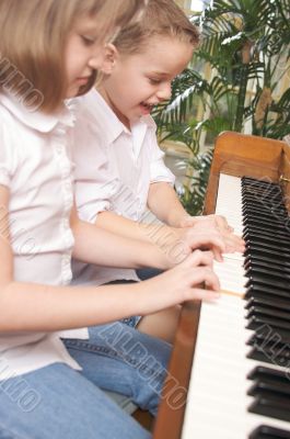 Children Playing the Piano