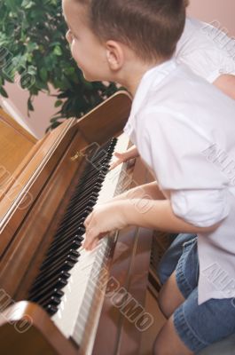 Children Playing the Piano