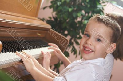 Children Playing the Piano
