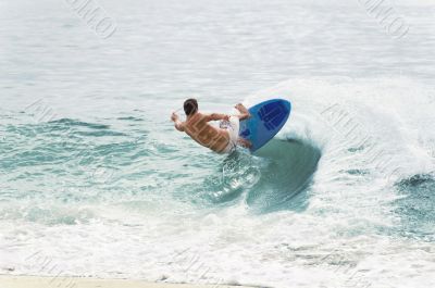 Surfer Balancing on Wave