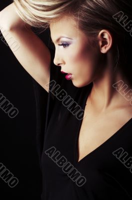 sexy blond girl on black background