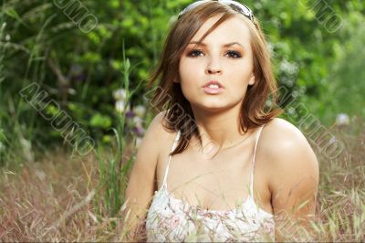 girl lying down of grass