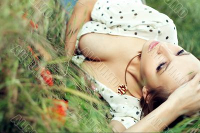 girl lying down of grass