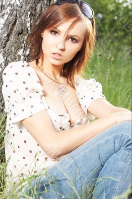 girl lying down of grass