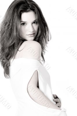 brunette in white shirt on white background high key looking at