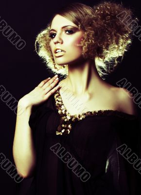 fashion model with curly hair in black tunic