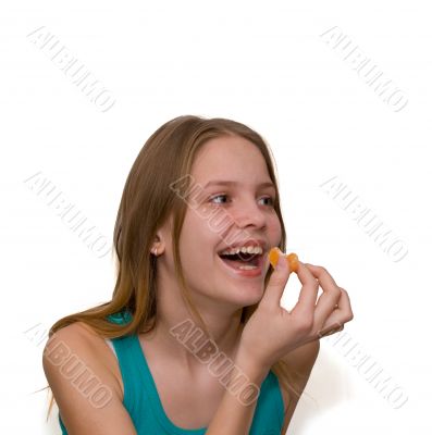 Young girl with tangerine