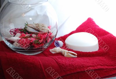 Glass vase with red floral.