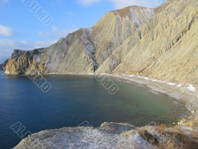 Winter beach and mountains