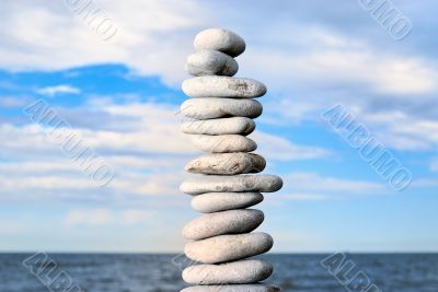 Grey stone tower on a beach