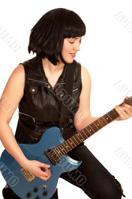 Young woman plays on a electric guitar