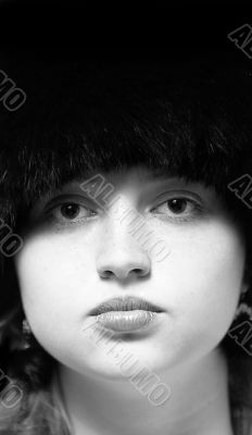 Black-n-white woman portrait in black fur-cap