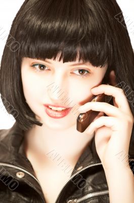 Young brunette talking to mobile phone