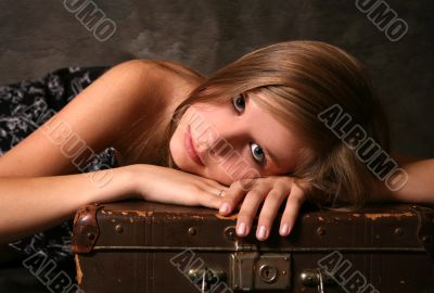 Girl with old suitcase
