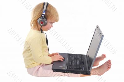 My daughter with computer and headphone