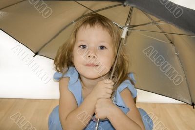 Small pretty girl with umbrella