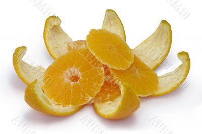 Slices of an orange on an orange peel.