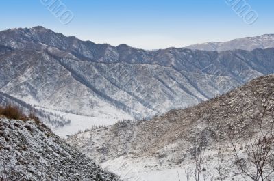 Horizon over mountains. Winter in Altay.