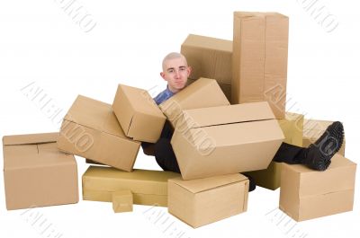 The man is heap up by boxes