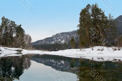 Nonfreezing Blue lake in Mountain Altai. Siberia.