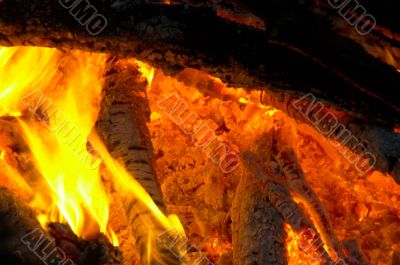 Flaming wooden coal logs