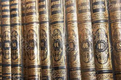 Row of old books cover spines