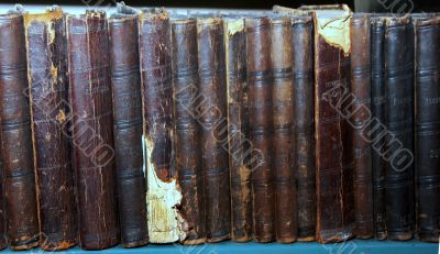 Row of old books cover spines