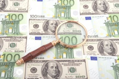 magnifier glass with money